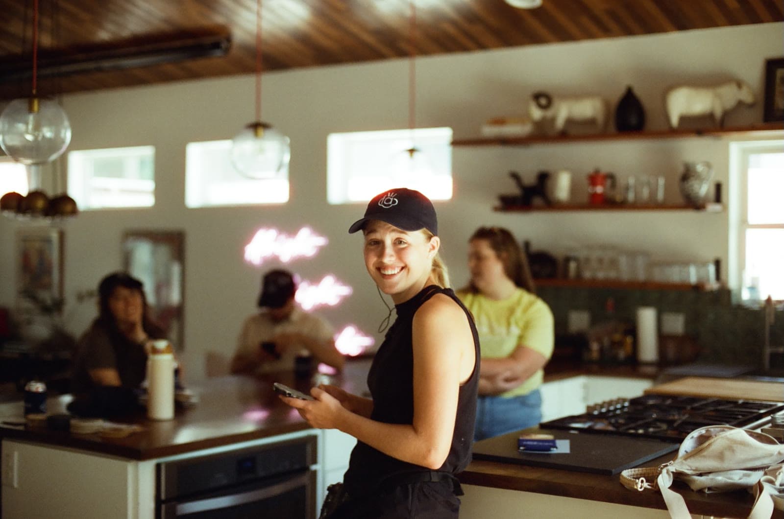 An actor laughs in a kitchen set between takes
